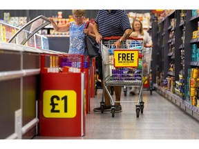 A customer places an item in their shopping trolley at an Iceland Foods Ltd. supermarket in Christchurch, UK, on Wednesday, June 15, 2022. "Britain's cost-of-living crisis -- on track to big the biggest squeeze since the mid-70s -- will continue to worsen before it starts to ease at some point next year," said Jack Leslie, senior economist at the Resolution Foundation, a research group campaigning against poverty.