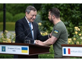 KYIV, UKRAINE - JUNE 16: Ukrainian President Volodymyr Zelensky and Italian Prime Minister Mario Draghi shake hands after a press conference on June 16, 2022 in Kyiv, Ukraine. The leaders made their first visits to Ukraine since the country was invaded by Russia on February 24th.