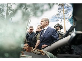 Olaf Scholz visits a war-torn suburb of Kyiv, on June 16.