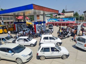 Vehicles wait in line at a gas station in Srinagar, earlier in June.  Photographer: Waseem Andrabi/Hindustan Times/Getty Images