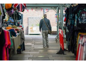 A shoppers browses the stalls in the Shambles Market in York, UK, on Monday, June 20, 2022. On Wednesday, inflation is set to rocket to a new 40-year high with the cost of goods leaving factories already racing ahead at a double-digit pace.