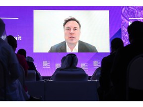 Elon Musk speaks via video link during the Qatar Economic Forum in Doha, on June 21. Photographer: Christopher Pike/Bloomberg