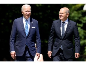 US President Joe Biden, left, and Olaf Scholz, Germany's chancellor, on the first day of the Group of Seven (G-7) leaders summit at the Schloss Elmau luxury hotel in Elmau, Germany, on Sunday, June 26, 2022. Issues on Sunday's formal agenda include the global economy, infrastructure and investment and foreign and security policy, while a number of bilateral meetings are also planned.