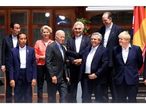 US President Joe Biden, center left, and Alberto Fernandez, Argentina's president, at the 'family' photo on day two of the Group of Seven (G-7) leaders summit at the Schloss Elmau luxury hotel in Elmau, Germany, on Monday, June 27, 2022. G-7 nations are set to announce an effort to pursue a price cap on Russian oil, US officials said, though there is not yet a hard agreement on curbing what is a key source of revenue for Vladimir Putin for his war in Ukraine.