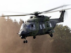 FILE - A NH90 multipurpose helicopter takes off during a demonstration event held for the media by the German Bundeswehr in Bergen near Hannover, Germany, Wednesday, Sept. 28, 2011. NATO-member Norway has terminated its contract for 14 NH90 helicopters, citing delays, errors, time-consuming maintenance, will return all choppers while demanding full refund of the nearly 5 billion ($525 million) kroner, the defense minister said Friday, June 10, 2022.
