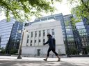 A person walks past the Bank of Canada building in Ottawa.