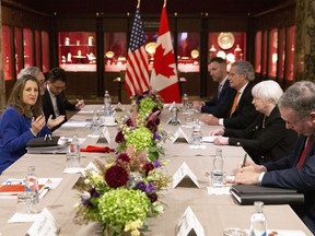 Canadian Deputy Prime Minister and Minister of Finance Chrystia Freeland (left) meets with U.S. Treasury Secretary Janet Yellen (second right) in Toronto, on Monday, June 20, 2022.