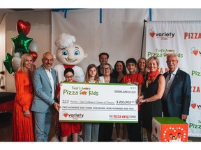 The cheque is a result of the funds raised by the 2022 That's Amore Pizza for Kids Campaign. Photo Credit: Kaj Larson