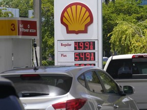 Car line up at a Shell gas station, Friday, June 17, 2022, in Miami.