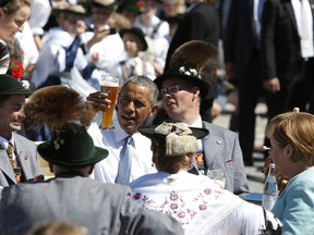 Barack Obama enjoys a beer with Angela Merkel in the morning of the summit of G7 nations on June 7, 2015.