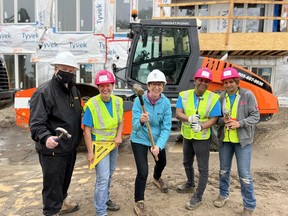 Durham Regional Chair & CEO John Henry (first from left), Habitat for Humanity GTA CEO Ene Underwood (centre), gather with Women Build Durham 2022 participants at the launch event on June 7, 2022.