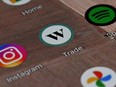 A Wealthsimple Trade app icon is shown on a smartphone on Tuesday, Dec. 15, 2020.