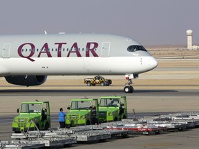 FILE - The first Qatar Airways plane in three years lands at King Khalid Airport in Riyadh, Saudi Arabia, Monday, Jan. 11, 2021. Qatar Airways, one of the Mideast's largest carriers known for on-board comfort and luxury, said Thursday, June 16, 2022 its profits over the past fiscal year topped $1.5 billion, marking the highest ever earnings for the state-owned carrier as it prepares to see a record surge in travelers for the upcoming FIFA World Cup soccer games.