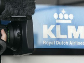 FILE - A cameraman films the Logo of Dutch airline KLM at the Cologne Bonn Airport in Cologne, western Germany, Sept. 26, 2008. Dutch flag carrier KLM announced Thursday, June 30, 2022 it is repaying the last portion of loans from the Netherlands government and banks to help it survive when the COVID-19 pandemic threw global aviation into a tailspin.