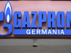 FILE - The logo of 'Gazprom Germania' is pictured at the company's headquarters in Berlin, April 6, 2022. Russian state-controlled energy giant Gazprom says gas deliveries through a key pipeline to Europe will drop by around 40% this year. The dpa news agency reports Tuesday, June 14 that Germany's utility network agency said it didn't see gas supplies as endangered and that reduced amounts through the Nord Stream 1 pipeline under the Baltic Sea aligned with commercial behavior and the previously announced cutoff of gas to Denmark and the Netherlands.