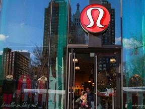 A shopper walks out of the Lululemon Athletica store in New York.