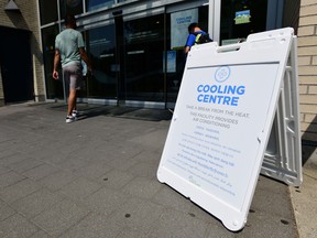 A person enters the Hillcrest Community Centre where they can cool off during the extreme hot weather in Vancouver in 2021.