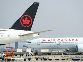 Air Canada planes sit on the tarmac at Pearson International Airport during the COVID-19 pandemic in Toronto on Wednesday, April 28, 2021.