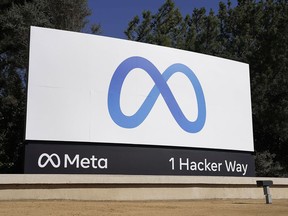 FILE - Facebook's Meta logo sign is seen at the company headquarters in Menlo Park, Calif. on Oct. 28, 2021. According to a report released Thursday, June 9, 2022, Facebook and parent company Meta once again failed to detect blatant, violent hate speech in advertisements submitted to the platform by the nonprofit groups Global Witness and Foxglove.