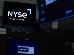 An NYSE sign is seen on the floor at the New York Stock Exchange in New York, Wednesday, June 15, 2022. Stocks are opening higher on Wall Street Thursday, June 23. The Labor Department said fewer Americans applied for jobless benefits last week as the U.S. job market remains robust.