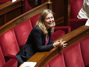 Yaël Braun-Pivet, a member of the centrist alliance Ensemble (Together) smiles at the National Assembly, Tuesday, June 28, 2022 in Paris. France's lower house of parliament opened its first session since President Emmanuel Macron's party lost its majority, and elected a woman, Yael Braun-Pivet, as speaker for the first time.