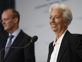 Christine Lagarde, European Central Bank President, and Netherlands Bank (DNB) President Klaas Knot, right, explain the Governing Council's monetary policy decisions during a press conference in Amsterdam, Netherlands, Thursday, June 9, 2022. The European Central Bank said it would carry out its first interest rate increase in 11 years in July, followed by another hike in September. The bank made the surprise move Thursday, saying that inflation had become a "major challenge" and that inflationary forces had "broadened and intensified."