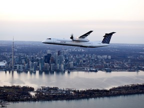 A Porter Airlines plane flying over Toronto.