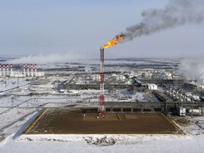 A flame burns from a tower at Vankorskoye oil field owned by Rosneft.