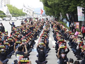 Members of Cargo Truckers Solidarity of the Korean Confederation of Trade Unions shout slogans during a rally in Gwangju, South Korea, Friday, June 10, 2022.