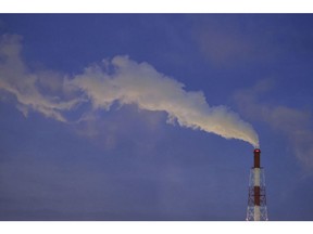 Steam rises from a stack at the Yokkaichi industrial complex at dusk in Yokkaichi, Mie Prefecture, Japan, on Monday, June 28, 2021.  Photographer: Kiyoshi Ota/Bloomberg
