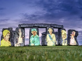 Images of Britain's Queen Elizabeth II from each decade of her reign, projected onto Stonehenge on Salisbury Plain in Wiltshire, England, to mark her Platinum Jubilee.