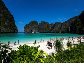 Tourists visit Thailand's famous Maya Bay beach in January.