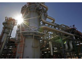 ALGERIA - DECEMBER 14: The In Salah Gas (ISG) Krechba Project, run by Sonatrach, British Petroleum (BP), and StatoilHydro, operates in the Sahara desert near In Salah, Algeria, on Sunday, Dec. 14, 2008. From produced gas, the carbon capture plant, the largest and first of its kind, removes annually the carbon dioxide emissions equivalent of 200,000 automobiles running 30,000 kilometers. The CO2 is then reinjected into a two-kilometer deep reservoir instead of the atmosphere, with the intention of storing it perpetually.