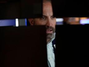 A trader works on the floor of the New York Stock Exchange.