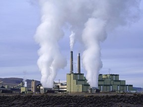 FILE - Steam billows from a coal-fired power plant Nov. 18, 2021, in Craig, Colo. The Supreme Court on Thursday, June 30, 2022, limited how the nation's main anti-air pollution law can be used to reduce carbon dioxide emissions from power plants. By a 6-3 vote, with conservatives in the majority, the court said that the Clean Air Act does not give the Environmental Protection Agency broad authority to regulate greenhouse gas emissions from power plants that contribute to global warming.