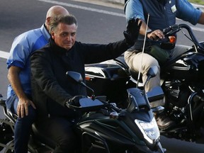 Brazil's President and presidential candidate Jair Bolsonaro leads a motorcycle rally, in Manaus, Brazil, Saturday, June 18, 2022. He will be running against his political nemesis, leftist former President Luiz Inacio Lula da Silva. While Bolsonaro has fervent support among his base, early polls say da Silva is leading handily before October's election.