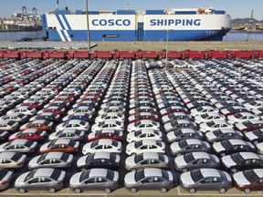 In this photo released by Xinhua News Agency, an aerial view shows manufactured vehicles before being loaded onto a cargo ship at the Yantai Port in eastern China's Shandong Province, Dec. 7, 2021. China's trade growth rebounded in May 2022 after anti-virus restrictions that shut down Shanghai and other industrial centers began to ease.