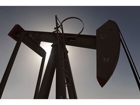 An oil pump, also known as a "nodding donkey," is seen operating in the Awali oil field in Bahrain, on Tuesday, Feb. 22, 2011. Anti-government riots that started in Tunisia before erupting in Egypt, Yemen, Libya, Algeria, Iran and Bahrain have sent crude to a 28-month high. Bloomberg