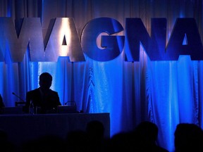 Magna International Inc. posted a loss in its most recent quarter as it recorded non-cash impairment charge related to its investment in Russia. The Magna International Inc., sign is shown at the company's annual general meeting to begin in Toronto on Friday, May 10, 2013.&ampnbsp;