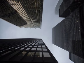 Bank buildings are photographed in Toronto's financial district on June 27, 2018. As inflation tops eight per cent, anyone with money in the bank is seeing their savings drip away at the fastest rate on record because deposit interest rates, still largely languishing at around one per cent, haven't kept up.