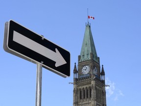 The federal government posted a surplus of $5.3 billion for the first two months of the 2022-23 fiscal year. The Peace Tower on Parliament Hill in Ottawa is shown on Sunday, Aug. 2, 2015.