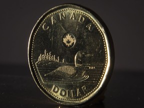 A Canadian dollar coin is pictured in North Vancouver, B.C. Wednesday, May 29, 2019. The loonie hit a 20-month low today, one day after the Bank of Canada announced its largest interest rate hike since 1998.&ampnbsp;THE CANADIAN PRESS/Jonathan Hayward