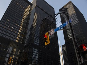 A rise in energy stocks helped lift Canada's main stock index in late-morning trading, while U.S. stock markets were mixed. Bay Street in Canada's financial district is shown in Toronto on Wednesday, March 18, 2020.