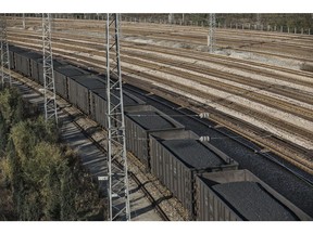 A train loaded with coal travels towards the Qinhuangdao Port in Qinhuangdao, China, on Friday, Oct. 28, 2016. China's efforts to quell surging coal prices showed signs they're working, with benchmark prices dropping for the first time in a year as the country's production rose to the highest in seven months. Photographer: Qilai Shen/Bloomberg