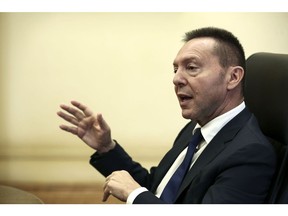 ECB's Stournaras says 'strong' crisis tool could stay on the shelf 2 Yannis Stournaras, Governor of the Bank of Greece, gestures as he speaks during an interview at the bank's headquarters in Athens, Greece, Friday, Nov. 25, 2016. This is "much too soon" to talk about the end of European Central Bank bond purchases, Stournaras said.