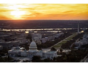 The U.S. Capitol is seen at dusk in this aerial photograph taken above Washington, D.C., U.S., on Tuesday, Nov. 4, 2019. Democrats and Republicans are at odds over whether to provide new funding for Trump's signature border wall, as well as the duration of a stopgap measure. Some lawmakers proposed delaying spending decisions by a few weeks, while others advocated for a funding bill to last though February or March. Photographer: Al Drago/Bloomberg