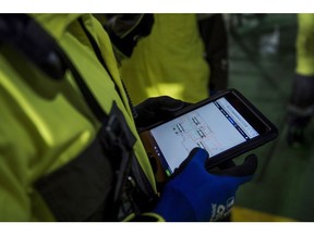An employee monitors data on a tablet device on a platform on the Johan Sverdrup oil field off the coast of Norway in the North Sea, on Tuesday, Dec. 3, 2019. Sverdrup's earlier-than-expected start in October broke a long trend of underperformance for Norway's overall oil production. Photographer: Carina Johansen/Bloomberg