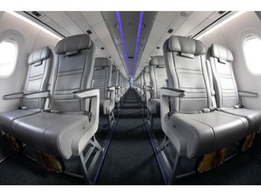 (EDITORS NOTE: Image was created using a fish-eye lens.) The interior of an Embraer SA 195-E2 aircraft is displayed during the Singapore Airshow at the Changi Exhibition Centre in Singapore, on Tuesday, Feb. 11, 2020. Planemakers and airlines are exploring new designs to reduce fuel burn and cut carbon emissions in a warming climate. Blending the wings with the fuselage to cut drag is one of several possible solutions.