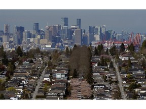 Downtown Vancouver past rows of single family homes in Vancouver.