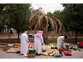 A vendor sells fruit and vegetables on a roadside in Riyadh, Saudi Arabia. Photographer: Tasneem Alsultan/Bloomberg